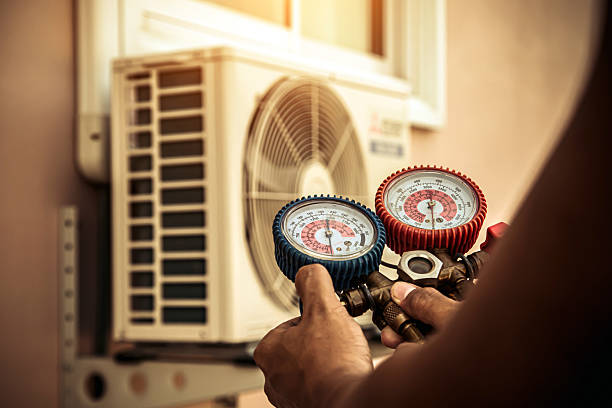 Professional Air Conditioning Service technician working in Wilkeson, WA